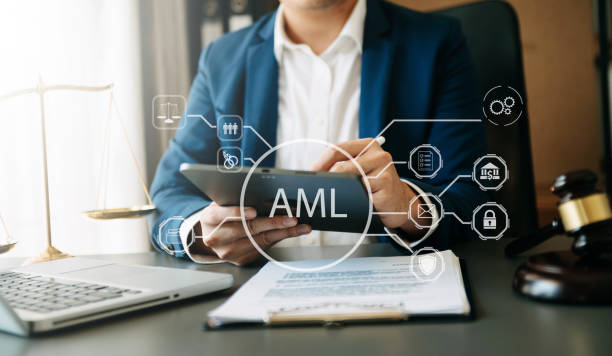 Lawyer reviewing AML compliance on a tablet. Money laundering red flags.