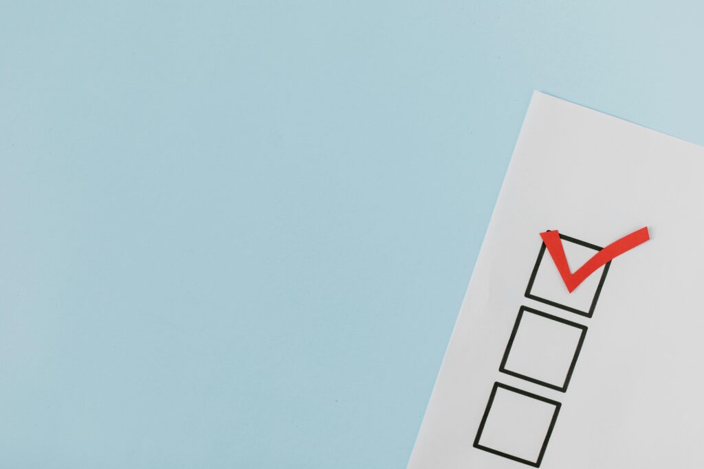 Checklist with a red checkmark; Australian AML compliance