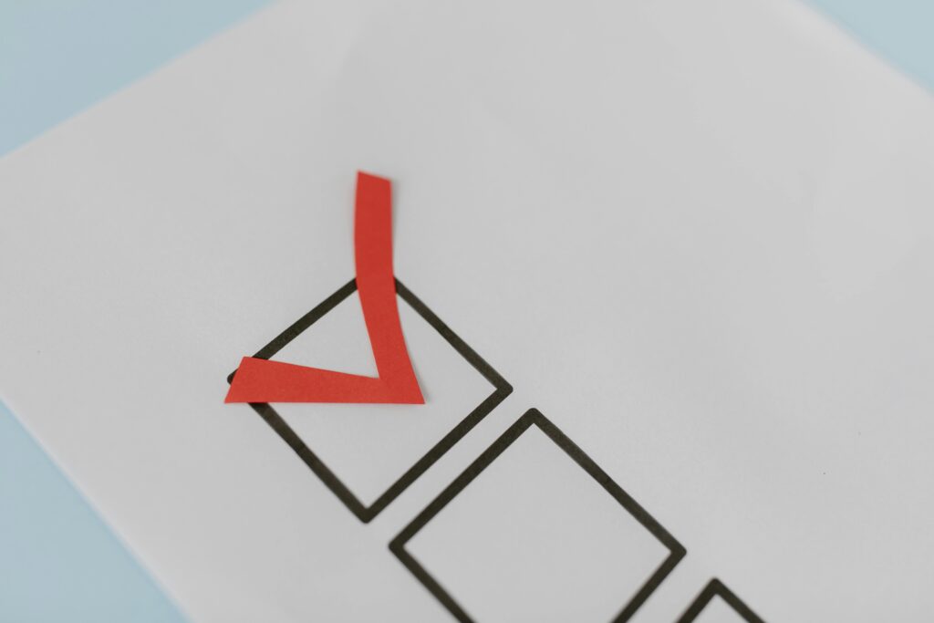 Red checkmark in a checkbox on a ballot paper, indicating a selection.